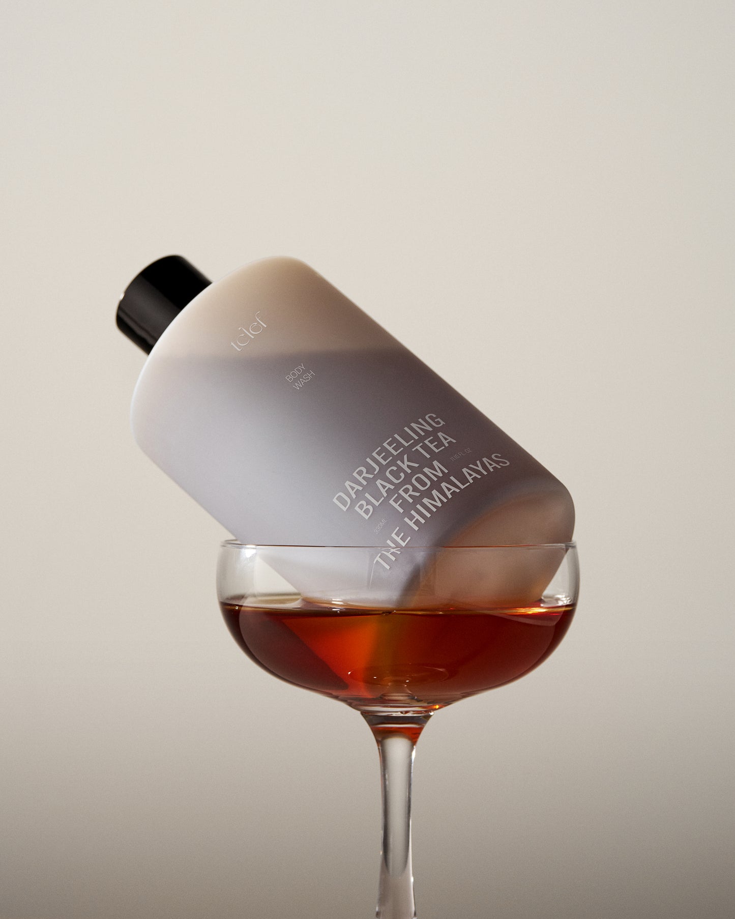 Elegant Himalayan Darjeeling black tea body wash placed on a spa background, symbolizing deep nourishment and relaxation.