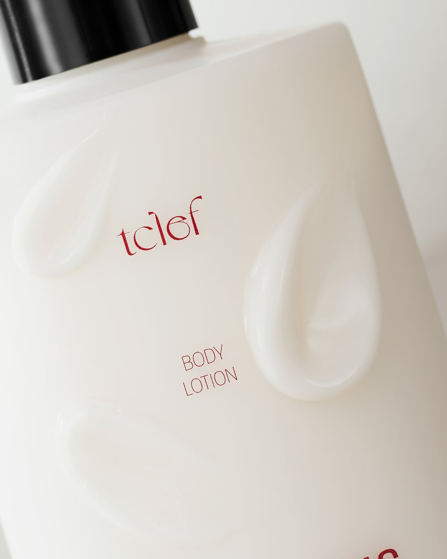 Elegant TCLEF Black Tea Body Lotion placed on a natural background with tea leaves, symbolizing deep hydration and vitality.