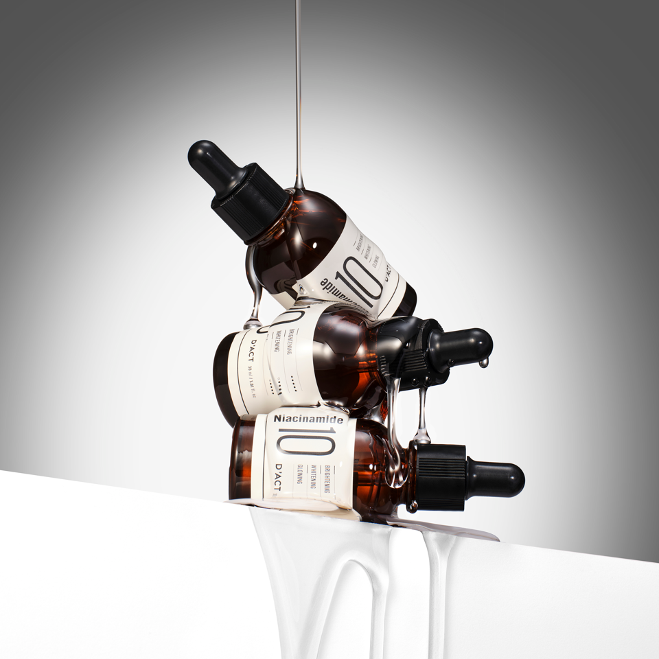 D'ACT Niacinamide 10 Serum next to toner and cream – part of a Korean K-beauty routine for clearer, glowing skin. Beautifulsmile cosmetics UK