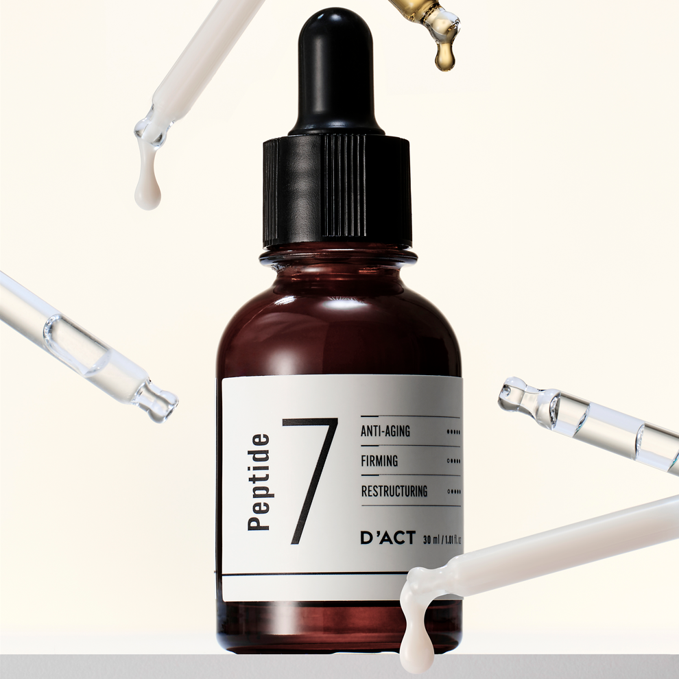 Dropper applying D'ACT Peptide 7 Serum – lightweight Korean peptide serum for skin firmness and hydration. Beautifulsmile cosmetics UK