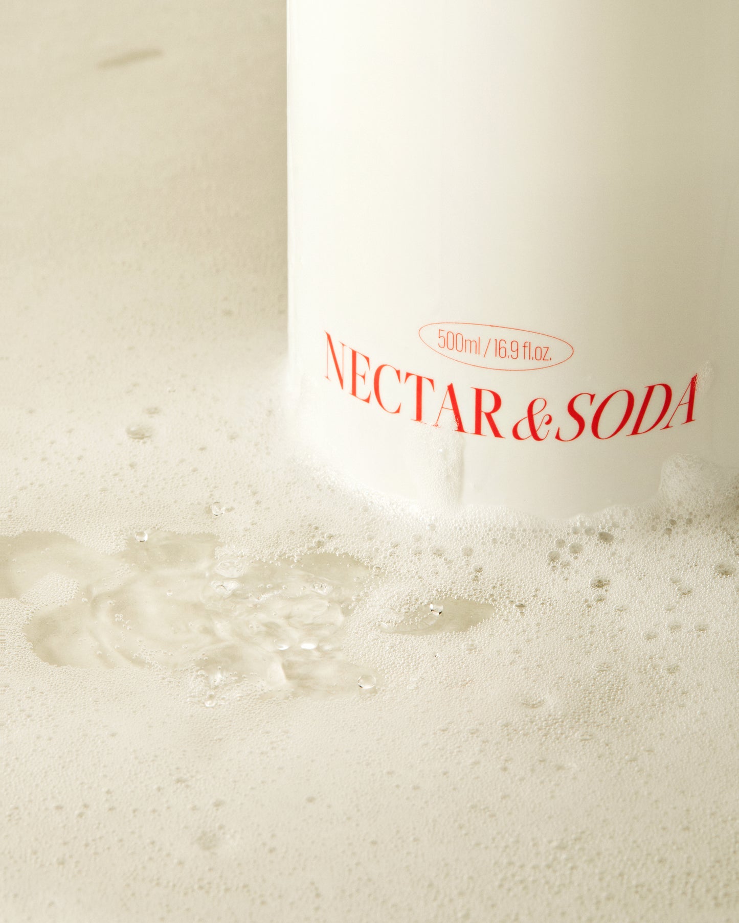 Revitalizing body cleanser featuring green plum extract and enzymes for smooth, radiant, and hydrated skin.