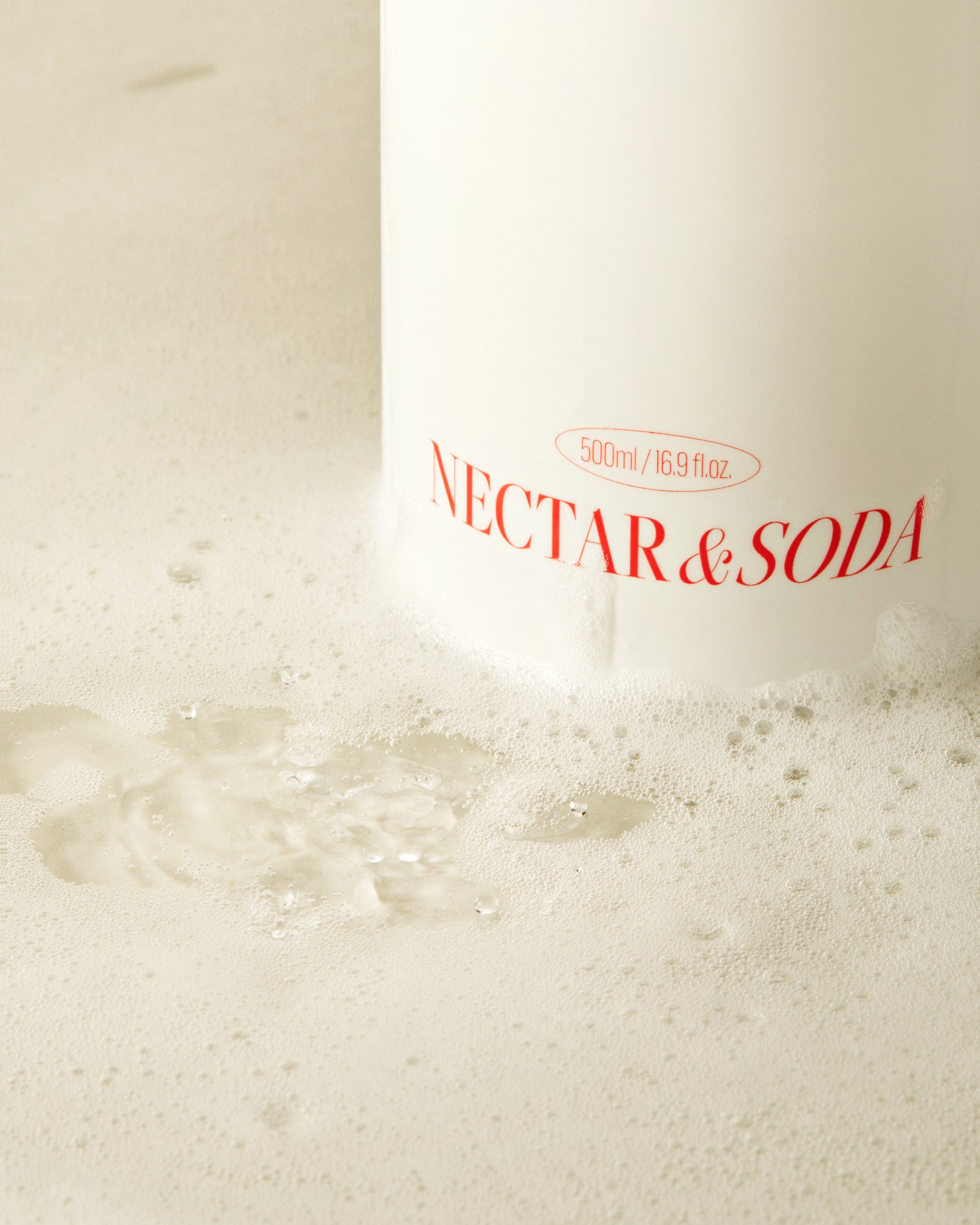 Revitalizing body cleanser featuring green plum extract and enzymes for smooth, radiant, and hydrated skin.