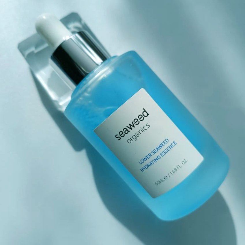 Hydrating seaweed essence in a sleek glass bottle with functional pump dispenser