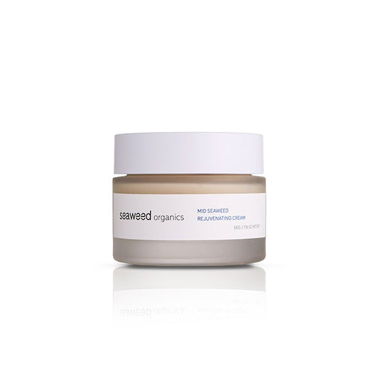 Midweight Seaweed Rejuvenating Cream jar with creamy texture on natural stone