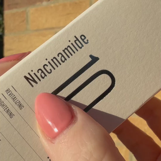 Applying D'ACT Niacinamide 10 Serum with dropper – lightweight K-beauty serum for even skin tone and pore care. Beautifulsmile cosmetics UK